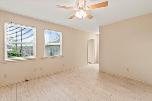 unfurnished room with light wood-style floors and ceiling fan