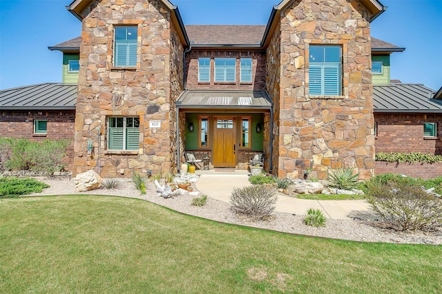 8225 Scotscraig Ct, Cleburne, TX 76033 - craftsman-style home featuring a standing seam roof, metal roof, and stone siding