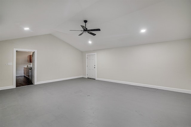 interior space with baseboards, lofted ceiling, ceiling fan, and recessed lighting