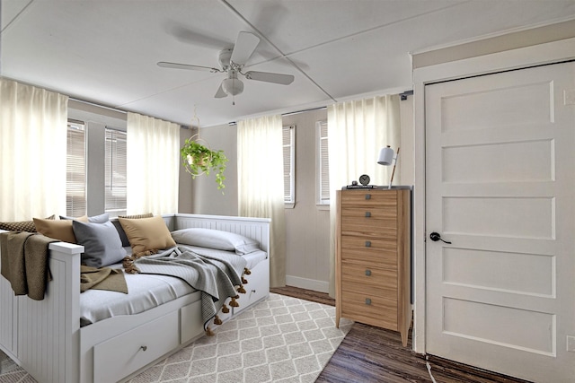 bedroom featuring ceiling fan and wood finished floors