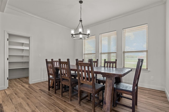 2017 Antler Loop, Poolville, TX 76487 - dining room featuring baseboards, a notable chandelier, ornamental molding, and light wood finished floors