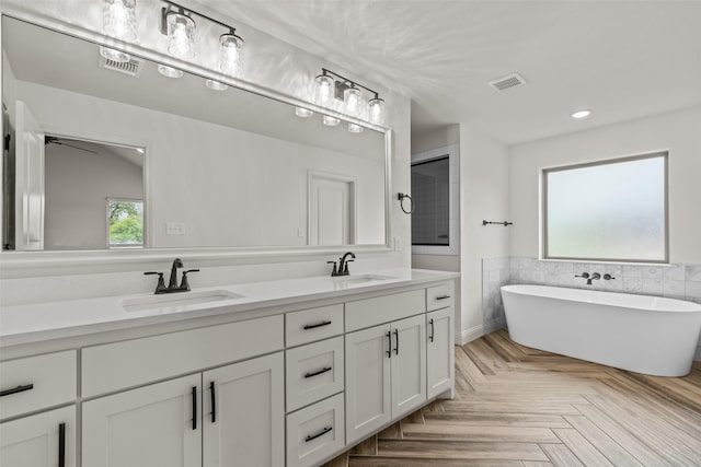 2017 Antler Loop, Poolville, TX 76487 - full bathroom featuring a freestanding tub, visible vents, and a sink