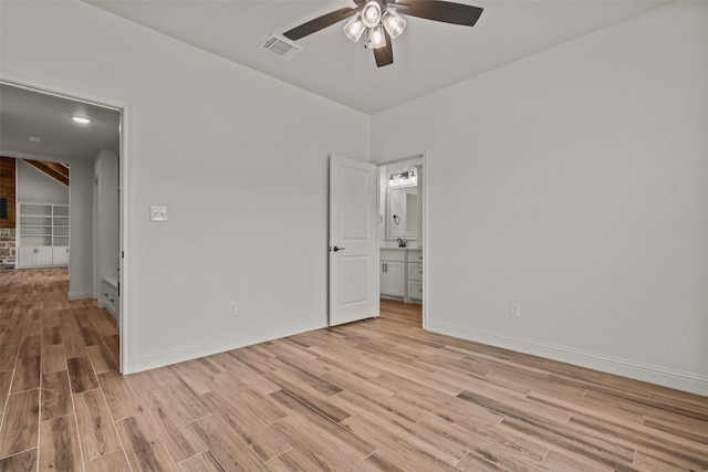 2017 Antler Loop, Poolville, TX 76487 - unfurnished bedroom featuring light wood-type flooring, a ceiling fan, ensuite bath, and visible vents