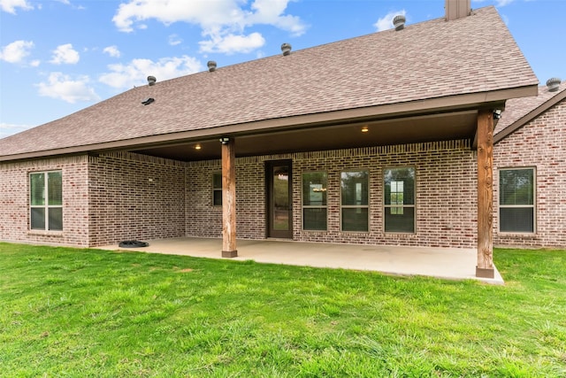 2017 Antler Loop, Poolville, TX 76487 - back of house with brick siding, a shingled roof, and a patio area