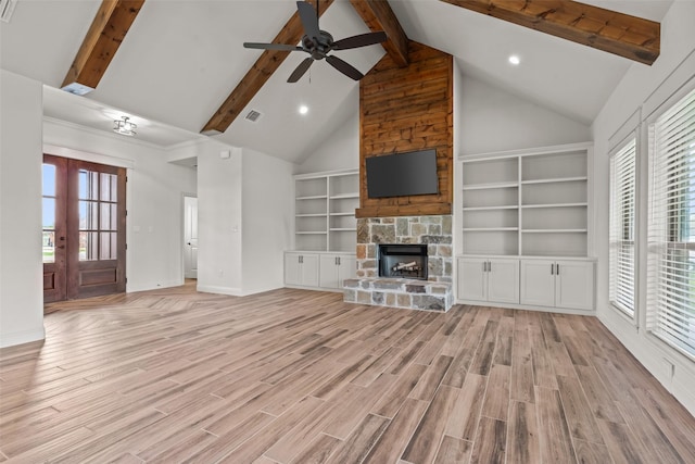 2017 Antler Loop, Poolville, TX 76487 - unfurnished living room featuring ceiling fan, baseboards, light wood-type flooring, beamed ceiling, and visible vents