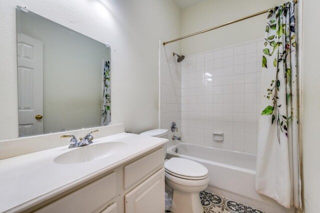 bathroom featuring shower / bathtub combination with curtain, toilet, and vanity