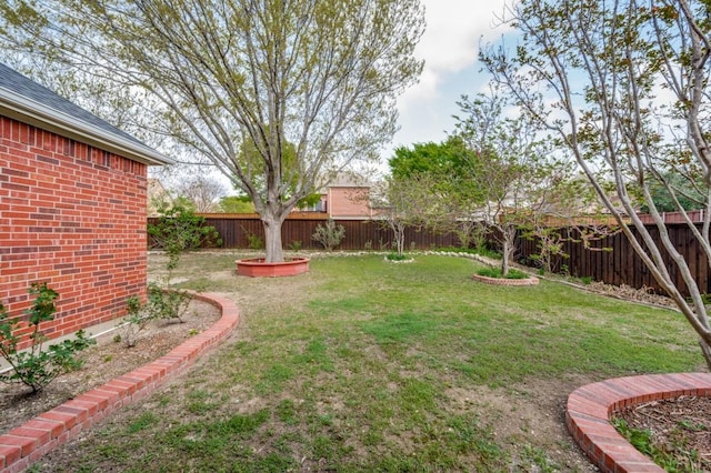 view of yard with a fenced backyard