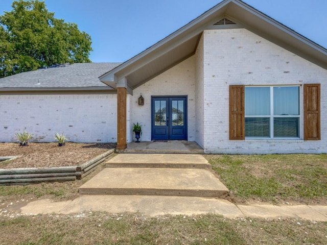 13125 Friendship Rd, Pilot Point, TX 76258 - view of exterior entry with french doors and brick siding