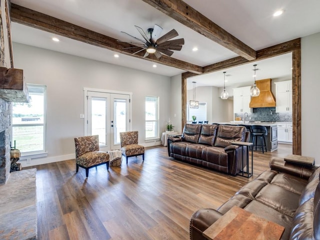 13125 Friendship Rd, Pilot Point, TX 76258 - living room with a ceiling fan, wood finished floors, plenty of natural light, recessed lighting, and french doors