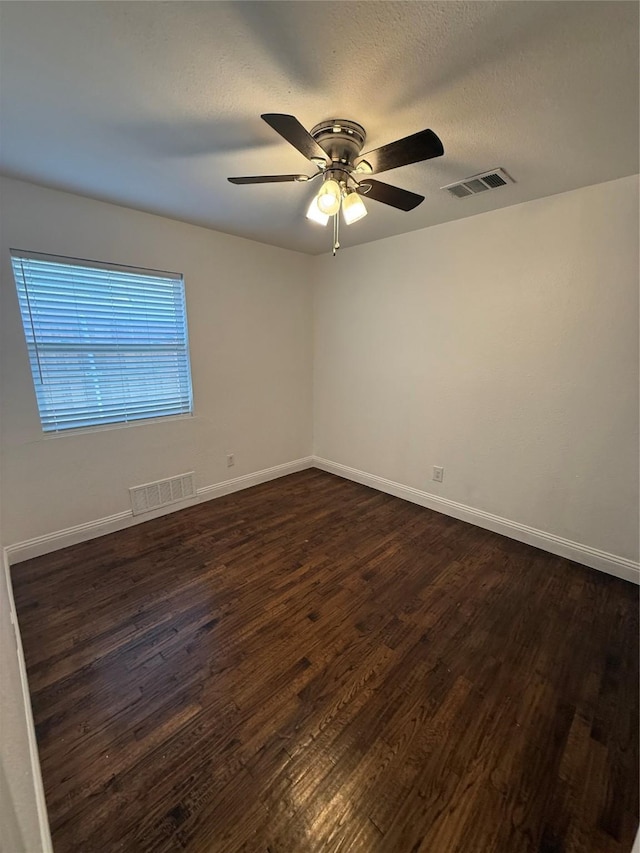 10388 Sandra Lynn Dr, Dallas, TX 75228 - unfurnished room with dark wood-style flooring, ceiling fan, and baseboards