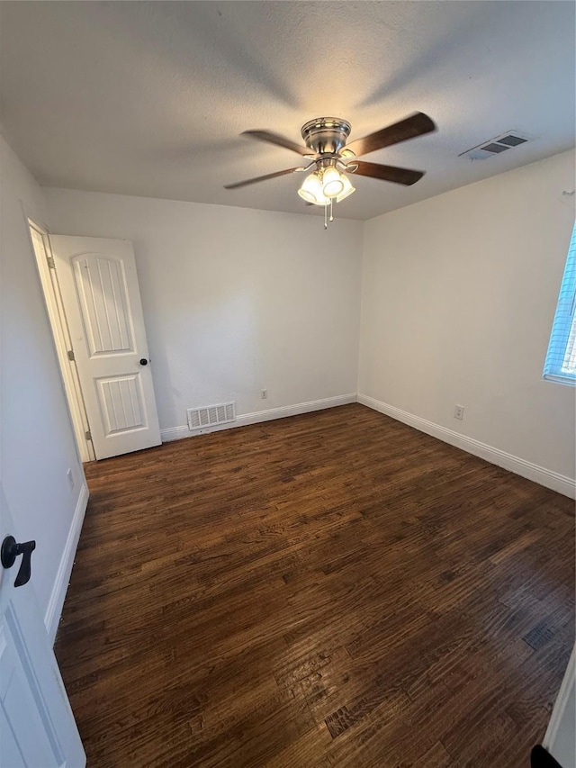 10388 Sandra Lynn Dr, Dallas, TX 75228 - empty room featuring a ceiling fan, dark wood-type flooring, and baseboards