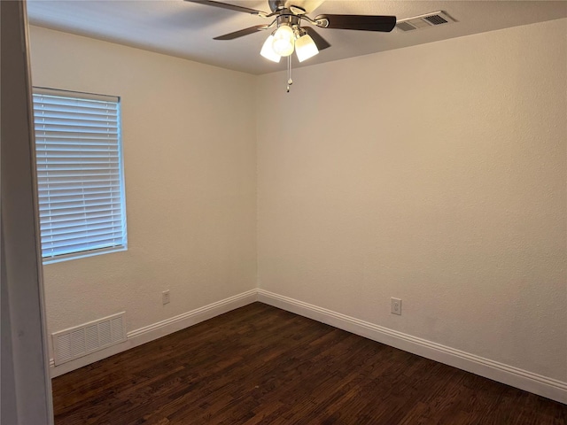 10388 Sandra Lynn Dr, Dallas, TX 75228 - spare room with dark wood-style floors, baseboards, and a ceiling fan