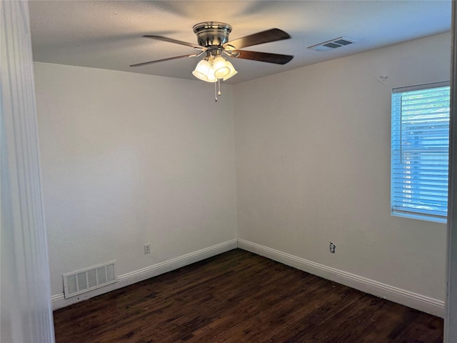 10388 Sandra Lynn Dr, Dallas, TX 75228 - spare room with dark wood finished floors, a ceiling fan, and baseboards