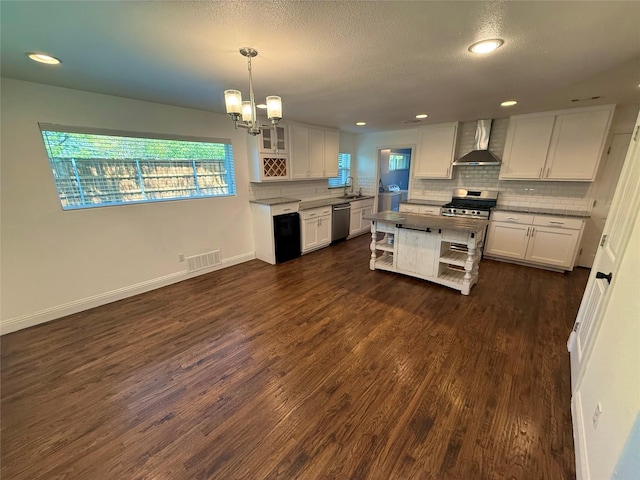 10388 Sandra Lynn Dr, Dallas, TX 75228 - kitchen with wall chimney range hood, dishwasher, white cabinets, decorative backsplash, and recessed lighting