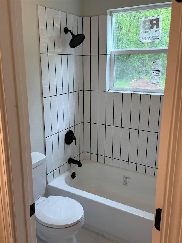 full bathroom with washtub / shower combination and toilet