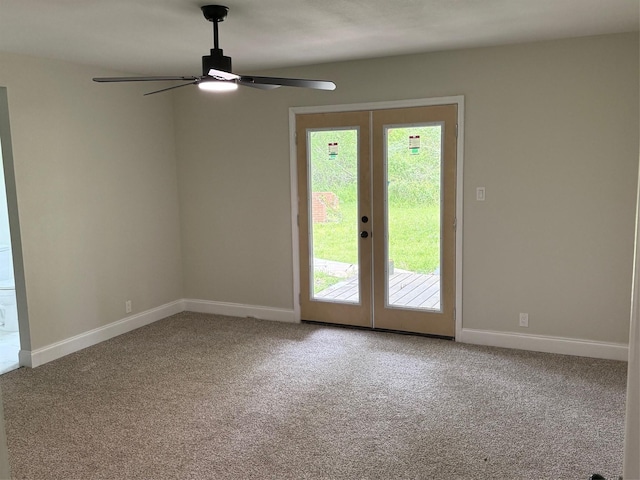 carpeted empty room with ceiling fan, french doors, and plenty of natural light