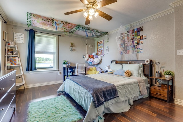 bedroom with crown molding, ceiling fan, wood finished floors, a textured wall, and baseboards
