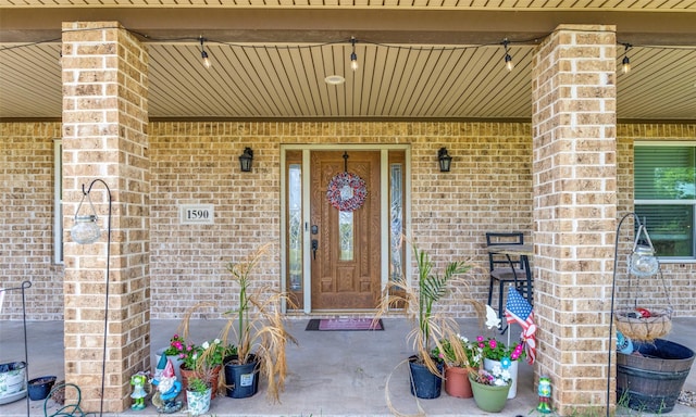 property entrance with brick siding