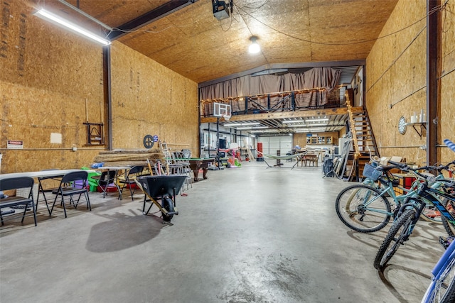 garage featuring a workshop area and a garage door opener