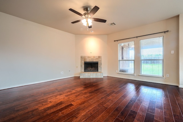 2760 Stoney Hollow Ln, Rockwall, TX 75087 - unfurnished living room featuring dark wood-style flooring, ceiling fan, a fireplace, and baseboards
