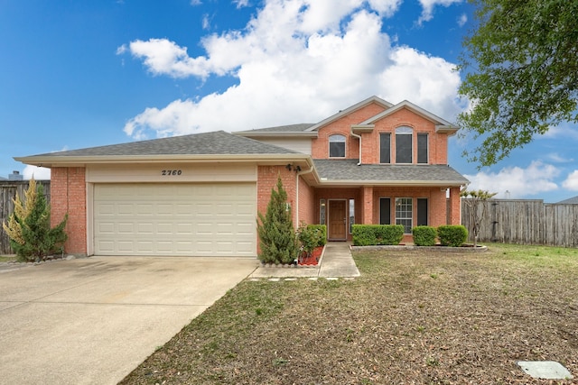view of front facade with brick siding, an attached garage, and driveway