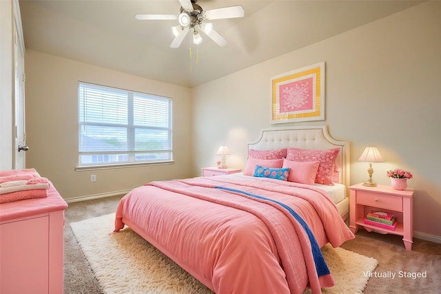 bedroom with carpet, baseboards, a ceiling fan, and vaulted ceiling