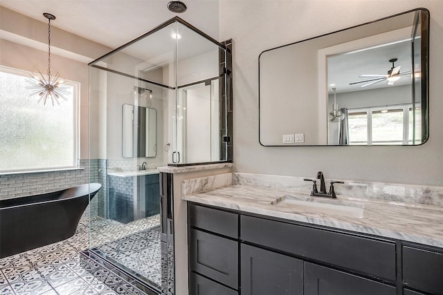 521 Echo Glade Ct, Azle, TX 76020 - full bath with healthy amount of natural light, a stall shower, a freestanding bath, vanity, and tile walls
