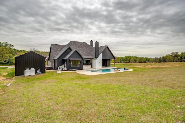 521 Echo Glade Ct, Azle, TX 76020 - rear view of property with a chimney, an outdoor pool, a yard, and a shingled roof