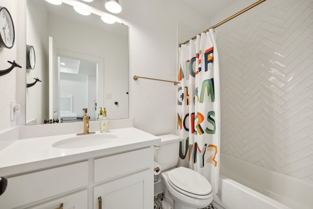 full bathroom with vanity, shower / bath combo, and toilet