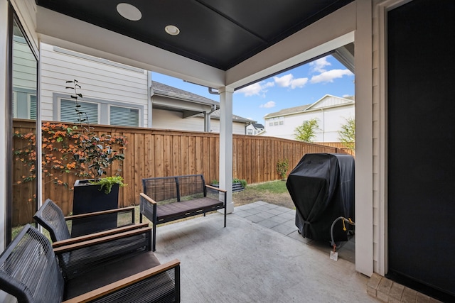 view of patio featuring area for grilling and a fenced backyard