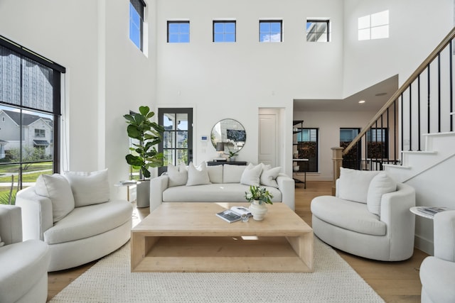 living area with plenty of natural light and a high ceiling