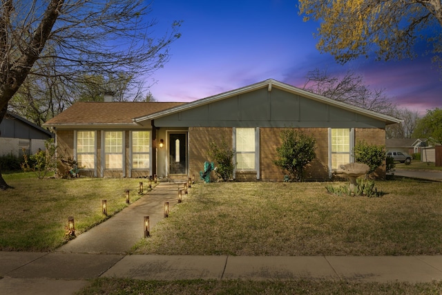 201 Volunteer Dr, Arlington, TX 76014 - ranch-style home with a chimney, a front yard, and brick siding