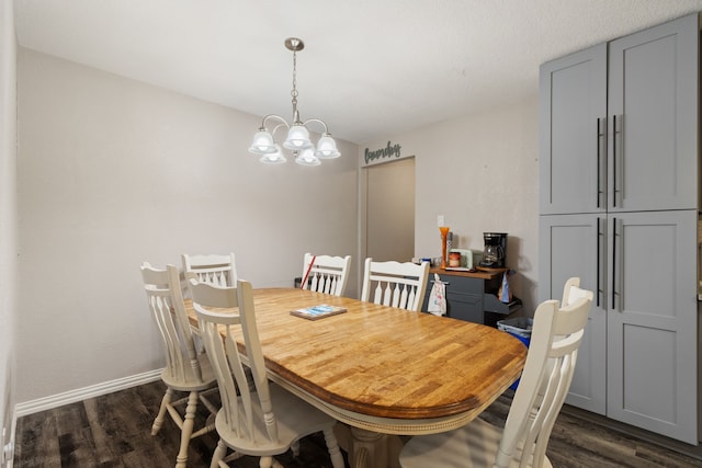201 Volunteer Dr, Arlington, TX 76014 - dining space featuring a notable chandelier, dark wood-style flooring, and baseboards