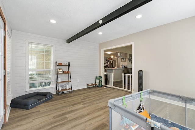 201 Volunteer Dr, Arlington, TX 76014 - interior space featuring wood finished floors, wooden walls, beam ceiling, and recessed lighting