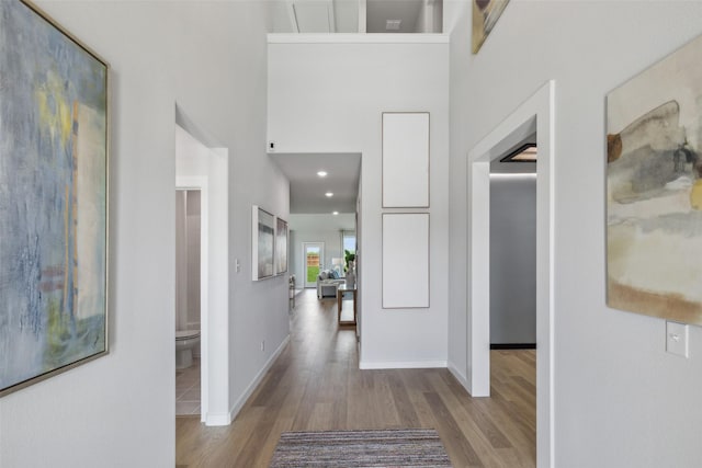 2756 Keokuk St, Fort Worth, TX 76179 - hallway featuring wood finished floors, baseboards, a high ceiling, and recessed lighting