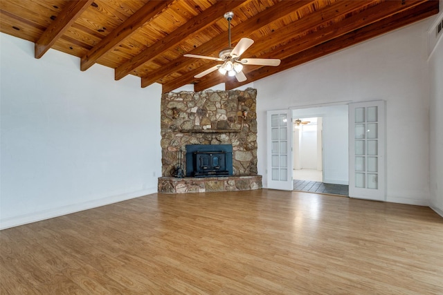 7219 Hickey Rd, Azle, TX 76020 - unfurnished living room with wooden ceiling, wood finished floors, a ceiling fan, baseboards, and french doors