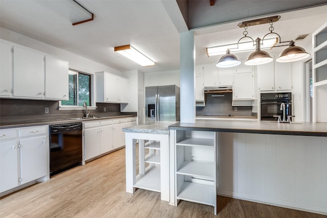 7219 Hickey Rd, Azle, TX 76020 - kitchen with open shelves, black appliances, under cabinet range hood, white cabinetry, and light wood-style floors