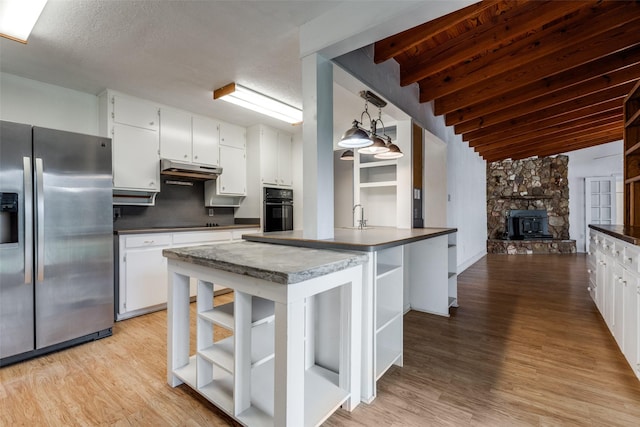 7219 Hickey Rd, Azle, TX 76020 - kitchen featuring open shelves, black appliances, dark countertops, under cabinet range hood, and white cabinetry