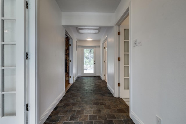 7219 Hickey Rd, Azle, TX 76020 - corridor featuring baseboards and dark stone finish floors