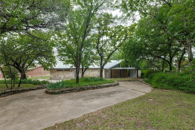 7219 Hickey Rd, Azle, TX 76020 - view of front of home featuring stone siding and concrete driveway