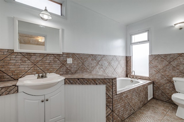 7219 Hickey Rd, Azle, TX 76020 - full bath featuring tile walls, toilet, a bath, vanity, and tile patterned flooring