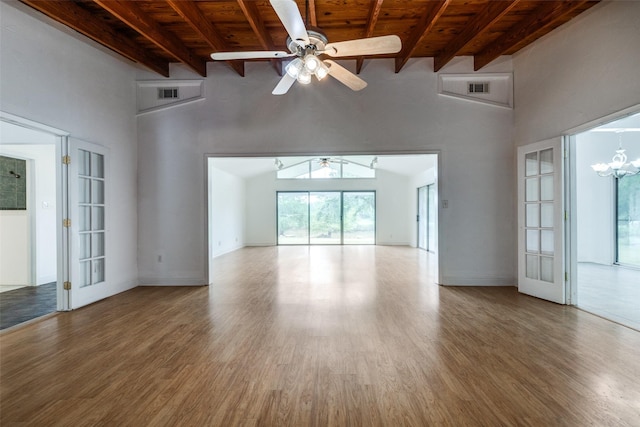 7219 Hickey Rd, Azle, TX 76020 - unfurnished living room with wooden ceiling with exposed beams, a ceiling fan, a chandelier, wood finished floors, and a high ceiling