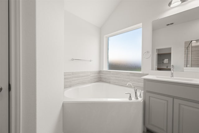 7745 Gatevine Ave, Joshua, TX 76058 - bathroom with vanity, a bath, and lofted ceiling