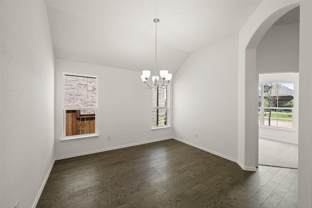 7745 Gatevine Ave, Joshua, TX 76058 - empty room featuring plenty of natural light, lofted ceiling, dark wood-type flooring, a chandelier, and arched walkways