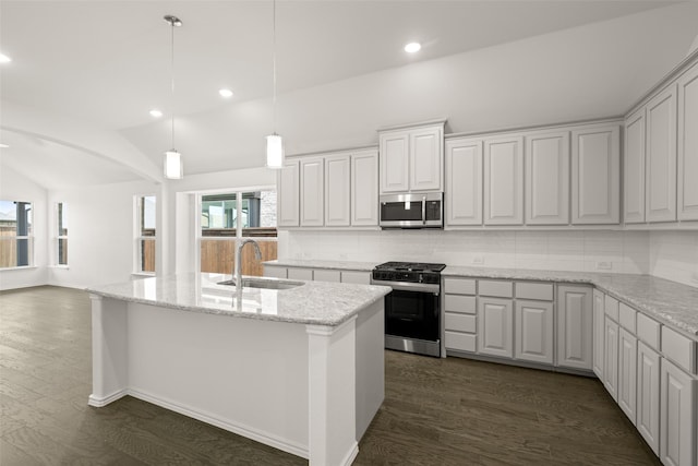 7745 Gatevine Ave, Joshua, TX 76058 - kitchen featuring stainless steel appliances, a sink, lofted ceiling, decorative backsplash, and dark wood finished floors