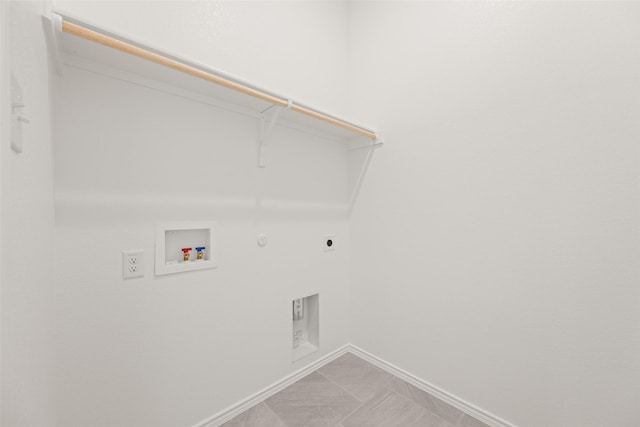 7745 Gatevine Ave, Joshua, TX 76058 - laundry area with hookup for an electric dryer, gas dryer hookup, hookup for a washing machine, and baseboards