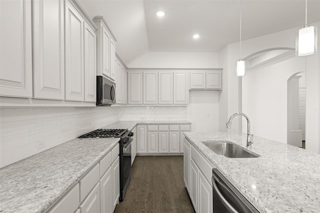 7745 Gatevine Ave, Joshua, TX 76058 - kitchen featuring appliances with stainless steel finishes, a sink, white cabinets, vaulted ceiling, and recessed lighting