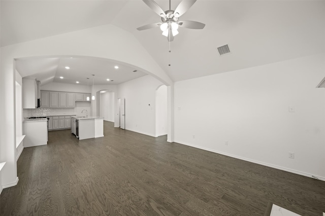 7745 Gatevine Ave, Joshua, TX 76058 - unfurnished living room with lofted ceiling, a ceiling fan, recessed lighting, a sink, and arched walkways