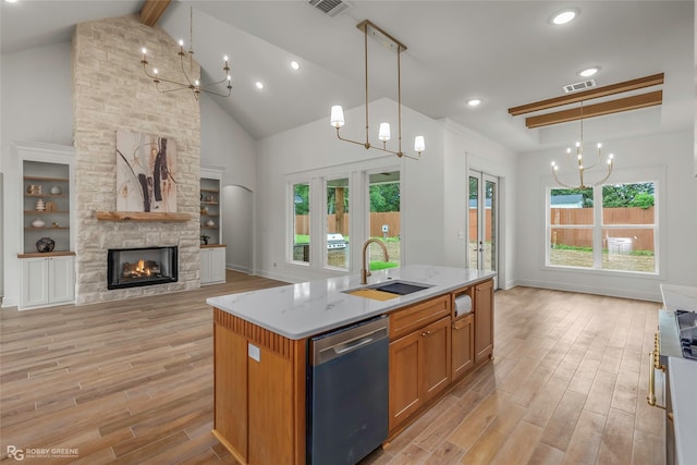 386 Newburn Ln, Shreveport, LA 71106 - kitchen with a sink, light wood-type flooring, dishwasher, open floor plan, and a notable chandelier