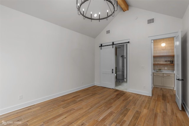 386 Newburn Ln, Shreveport, LA 71106 - unfurnished bedroom featuring a barn door, high vaulted ceiling, visible vents, and beam ceiling